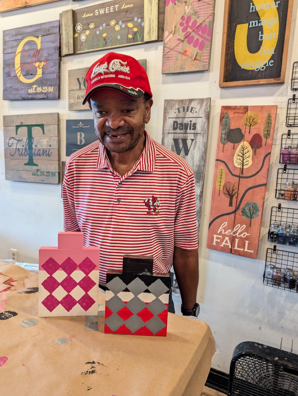Man with Cedar Lake t-shirt gives high five to volunteer